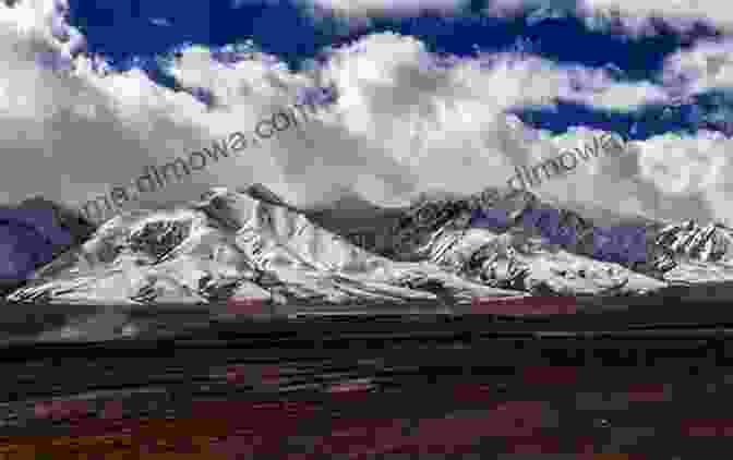 A Breathtaking View Of The Tibetan Plateau, With Snow Capped Mountains And Rolling Hills Motorbike Travels: Tibet Niall Harbison