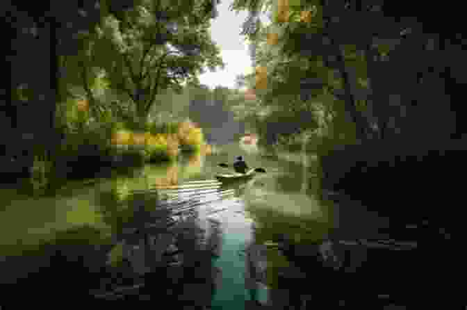 A Kayaker And A Canoeist Paddle Through A Tranquil Lake, Surrounded By Lush Greenery. South Fork Of The New River Guide: Section By Section Guide For Paddling